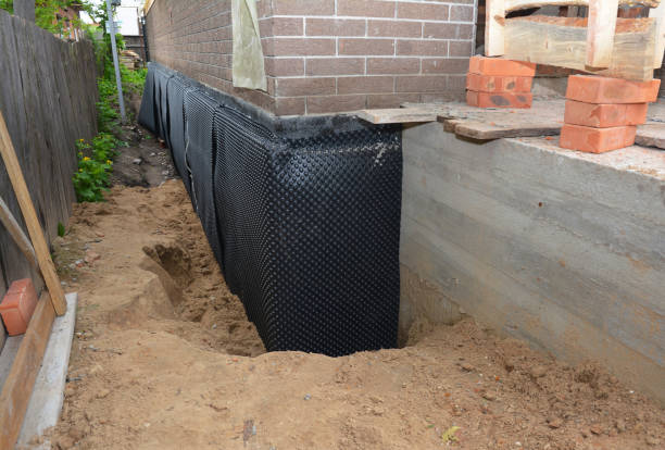 Happy homeowners after waterproofing job in Clyde